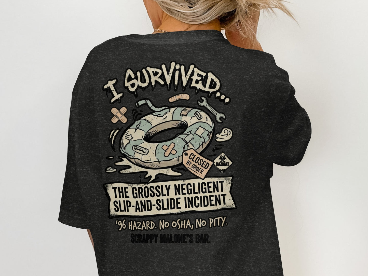 Dark t-shirt with graphic: "I Survived... The Grossly Negligent Slip-and-Slide Incident"
