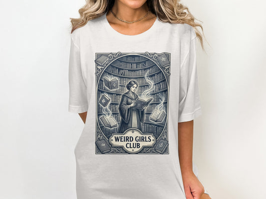Woman in t-shirt with "Weird Girls Club" logo featuring a woman reading among books.