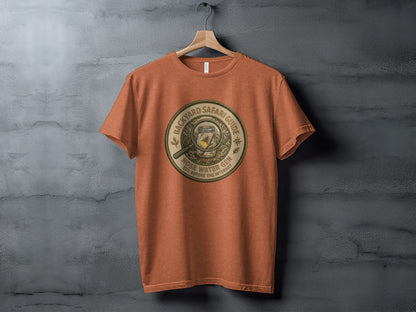 Backyard Safari Guide Explorer: Backcountry Outpost Shirt: Orange t-shirt with "Backyard Safari Guide" circular graphic.