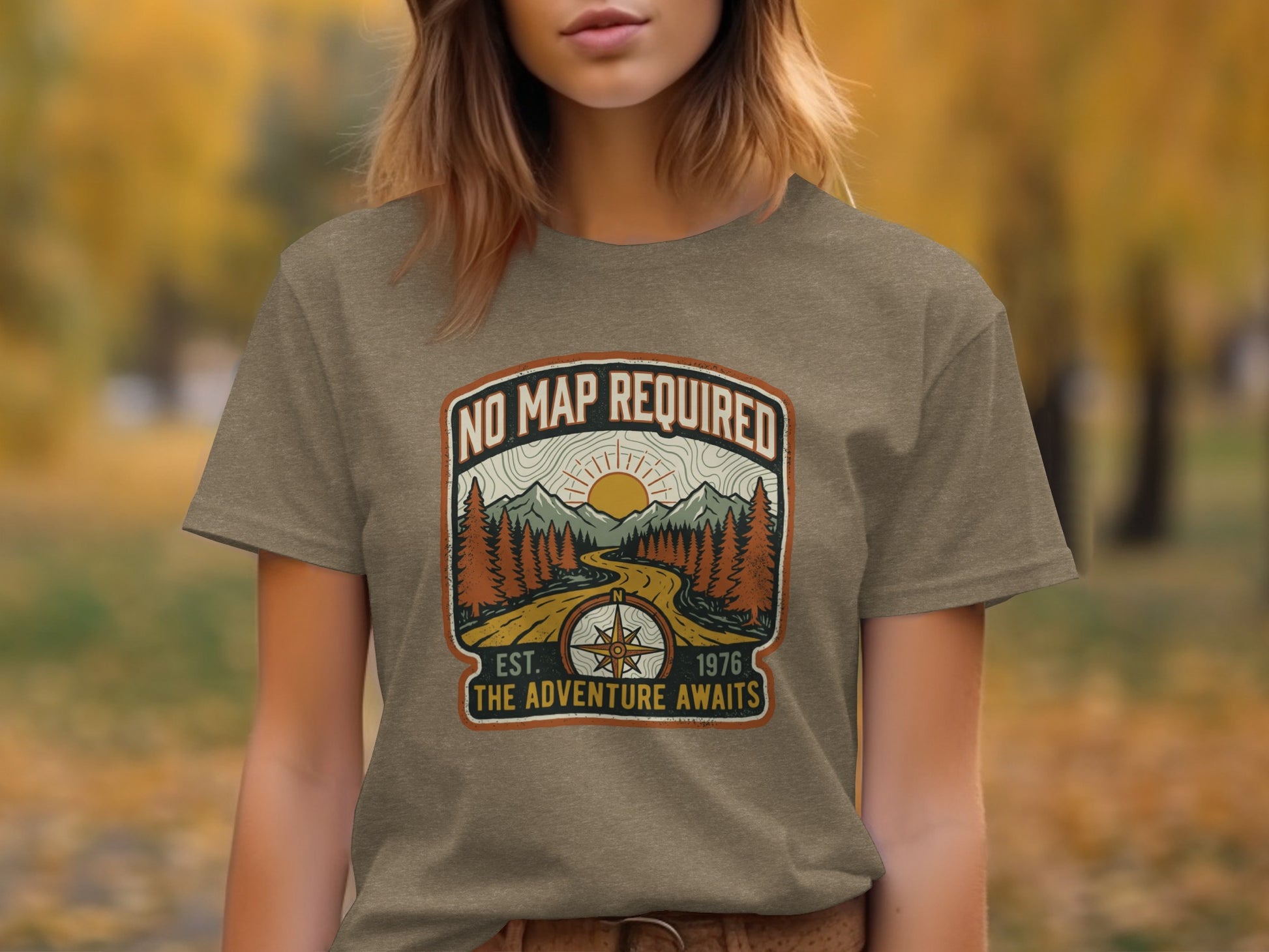 Heritage No Map Required: The Adventure Awaits Nomad Tee: Brown t-shirt with "No Map Required" graphic of compass, mountains, and sun.