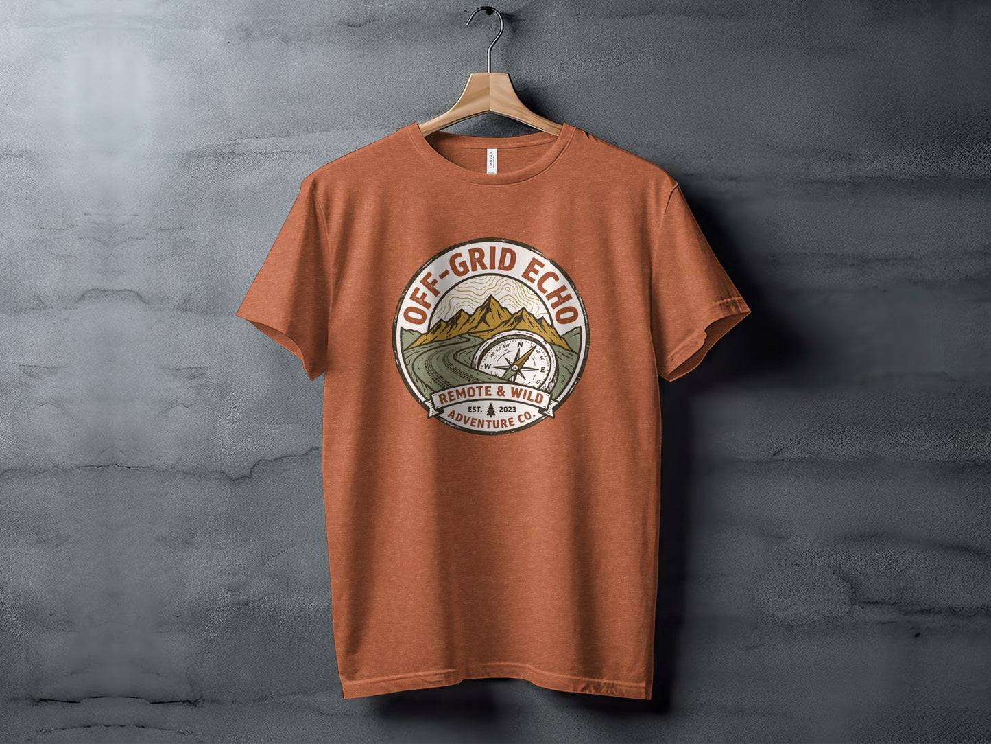 Off-Grid Echo Explorer: The Explorer's Adventure Tee: Orange t-shirt with "Off-Grid Echo" circular logo featuring compass and mountains.