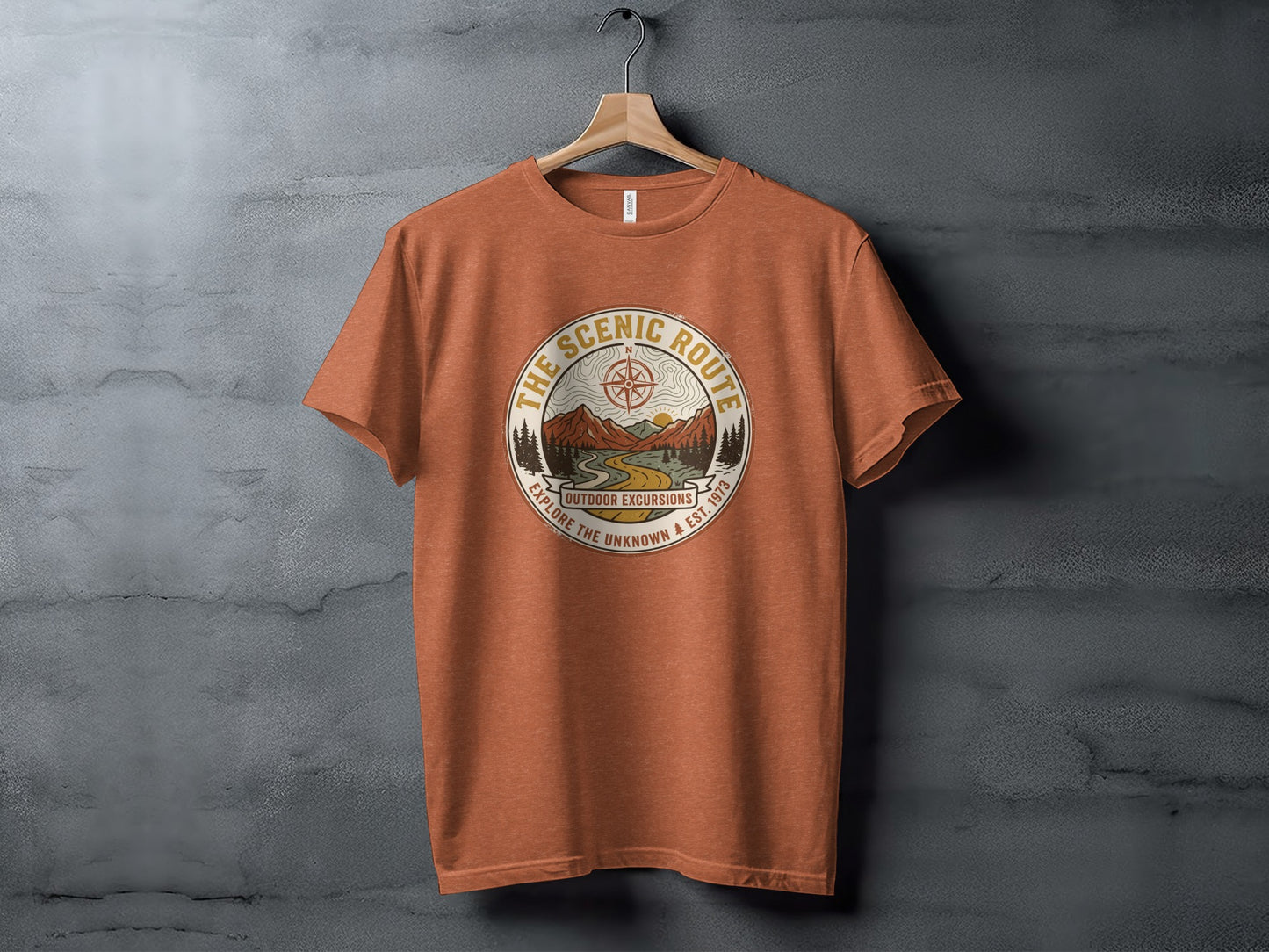 Heritage Scenic Route Vintage Explorer Tee Nomad Tee: Orange t-shirt with circular outdoor excursion graphic and text.