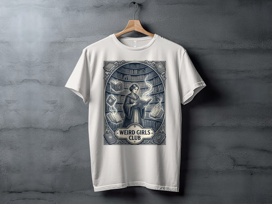 White t-shirt featuring "Weird Girls Club" text and a woman reading amidst bookshelves.