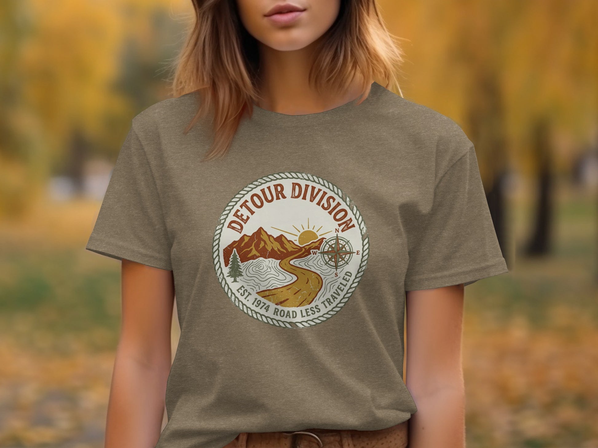 Detour Division Heritage | Vintage Outdoor Apparel: Brown t-shirt with circular "Detour Division" logo featuring mountains, road, and compass.