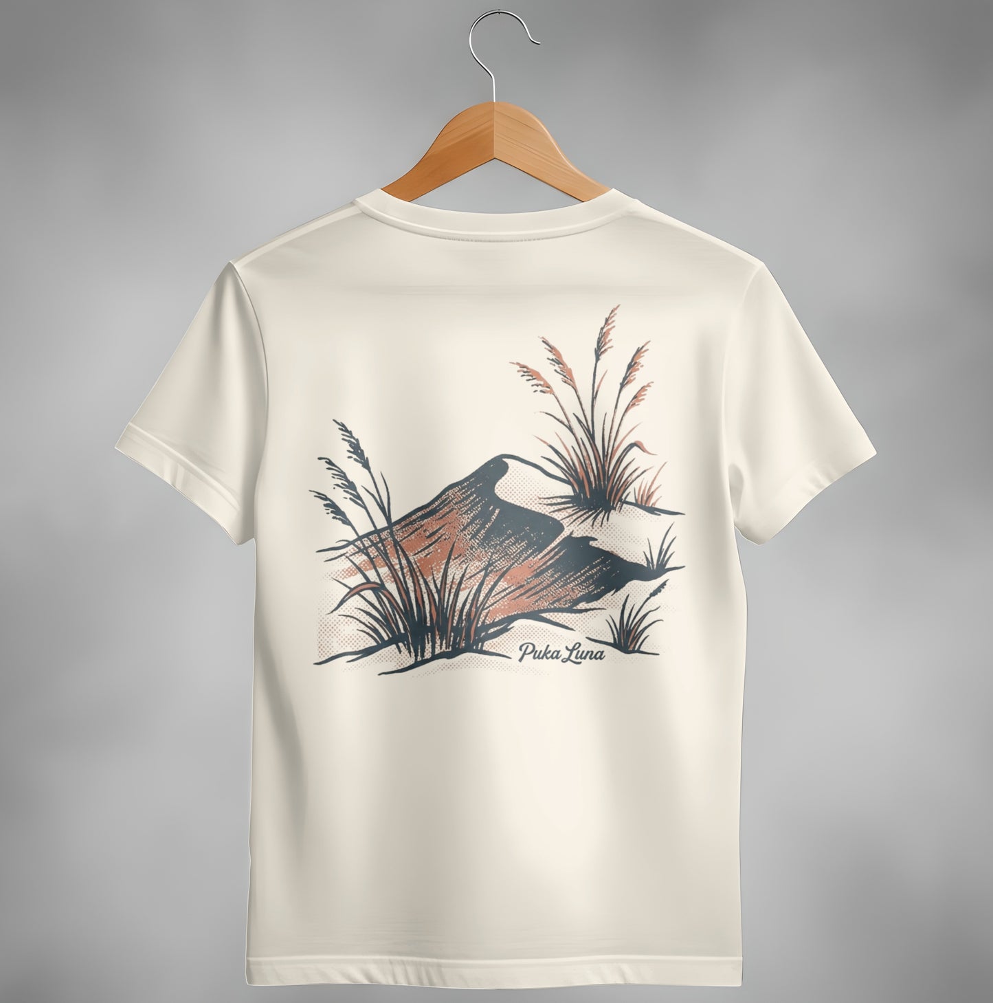 Cream t-shirt with desert landscape graphic and "Puka Luna" text.