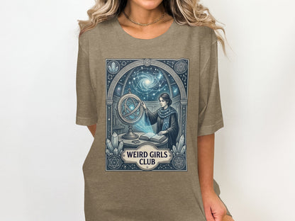 T-shirt graphic with celestial map, astrolabe, and "Weird Girls Club" text.