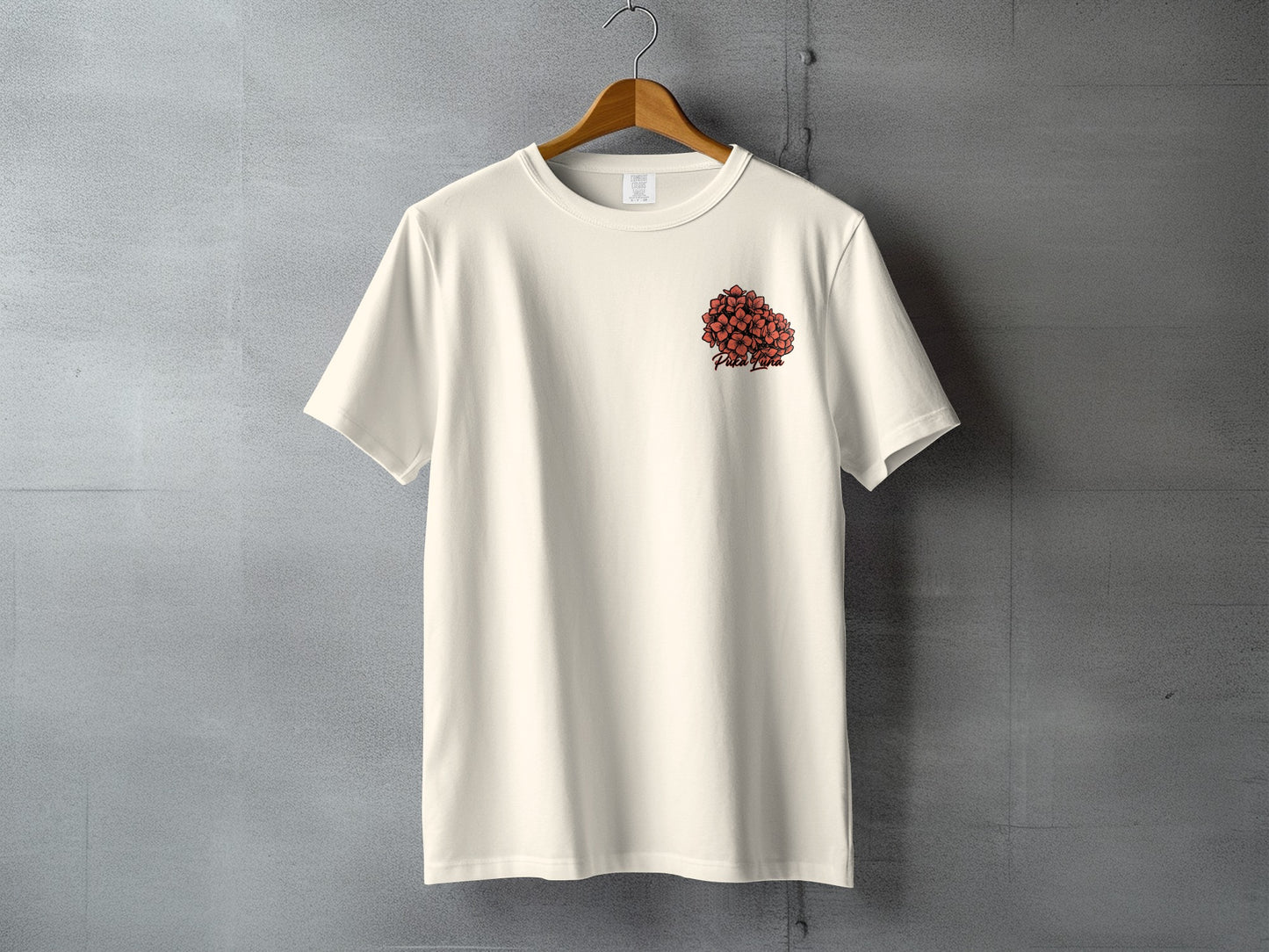 Cream t-shirt with red floral design and "Peach Planet" text on the left chest.