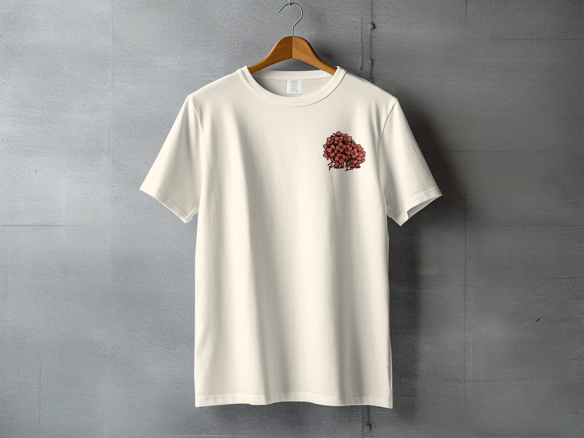 Cream t-shirt with red floral design and "Peach Planet" text on the left chest.