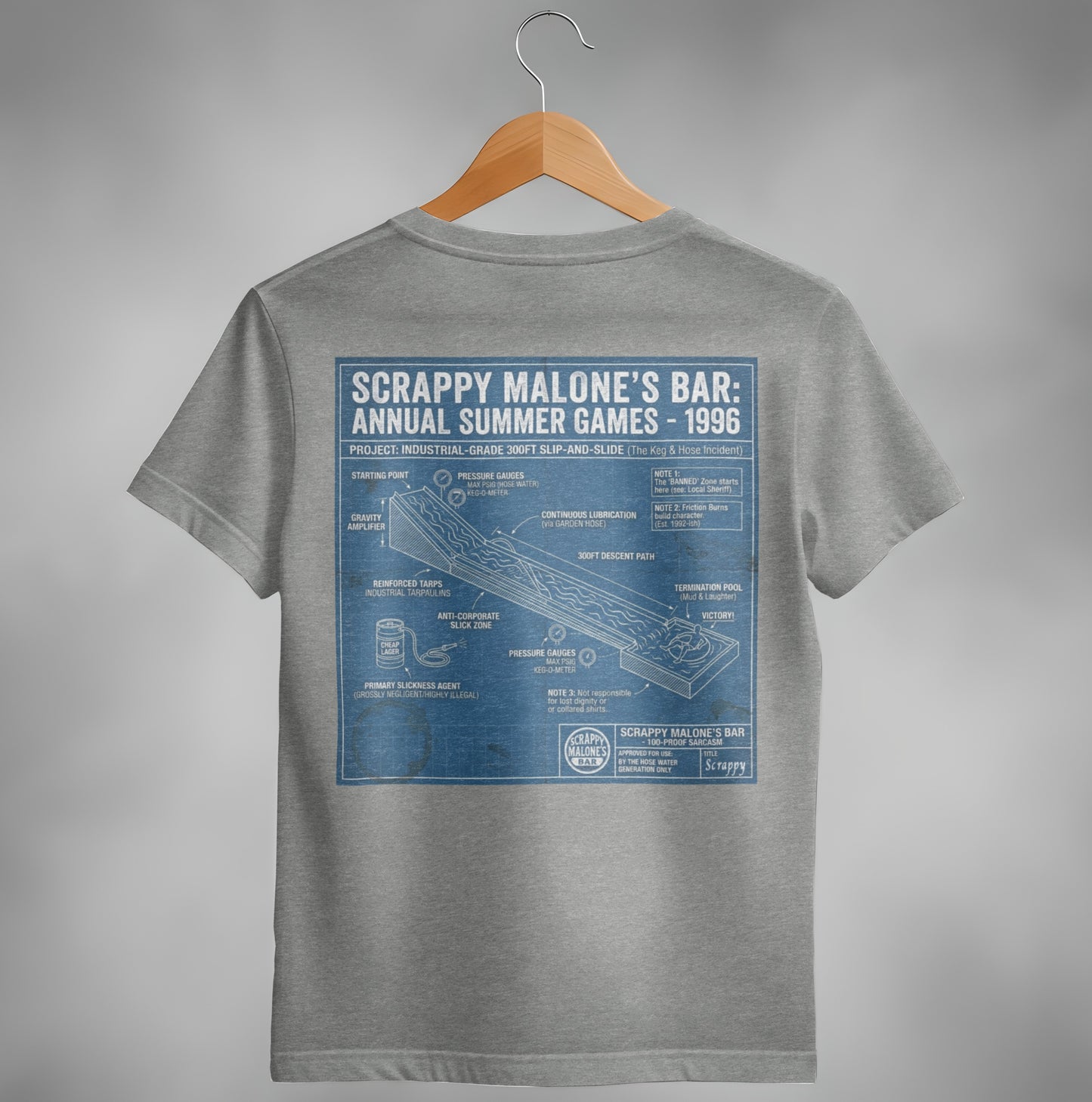 T-shirt graphic detailing Scrappy Malone's Bar's 1996 slip-and-slide with labeled components and notes.