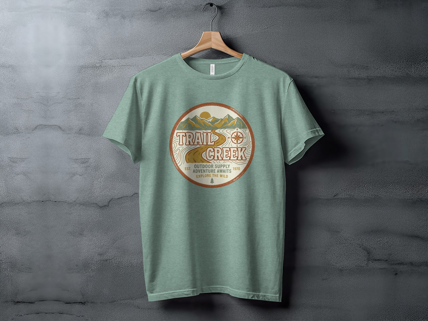 Heritage Heritage Explorer Trail Creek Nomad Tee: Green t-shirt with a circular logo for Trail Creek Outdoor Supply.