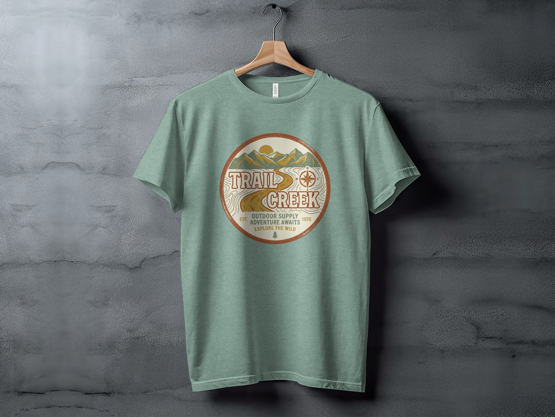 Heritage Heritage Explorer Trail Creek Nomad Tee: Green t-shirt with a circular logo for Trail Creek Outdoor Supply.