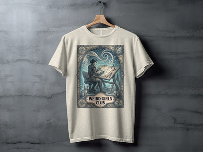 Light gray t-shirt with "Weird Girls Club" graphic of woman drawing in ornate frame.