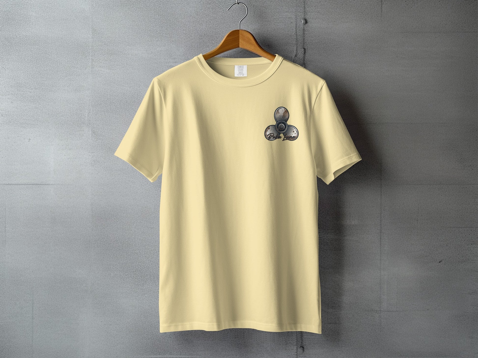 Pale yellow t-shirt with a fidget spinner graphic on the left chest.