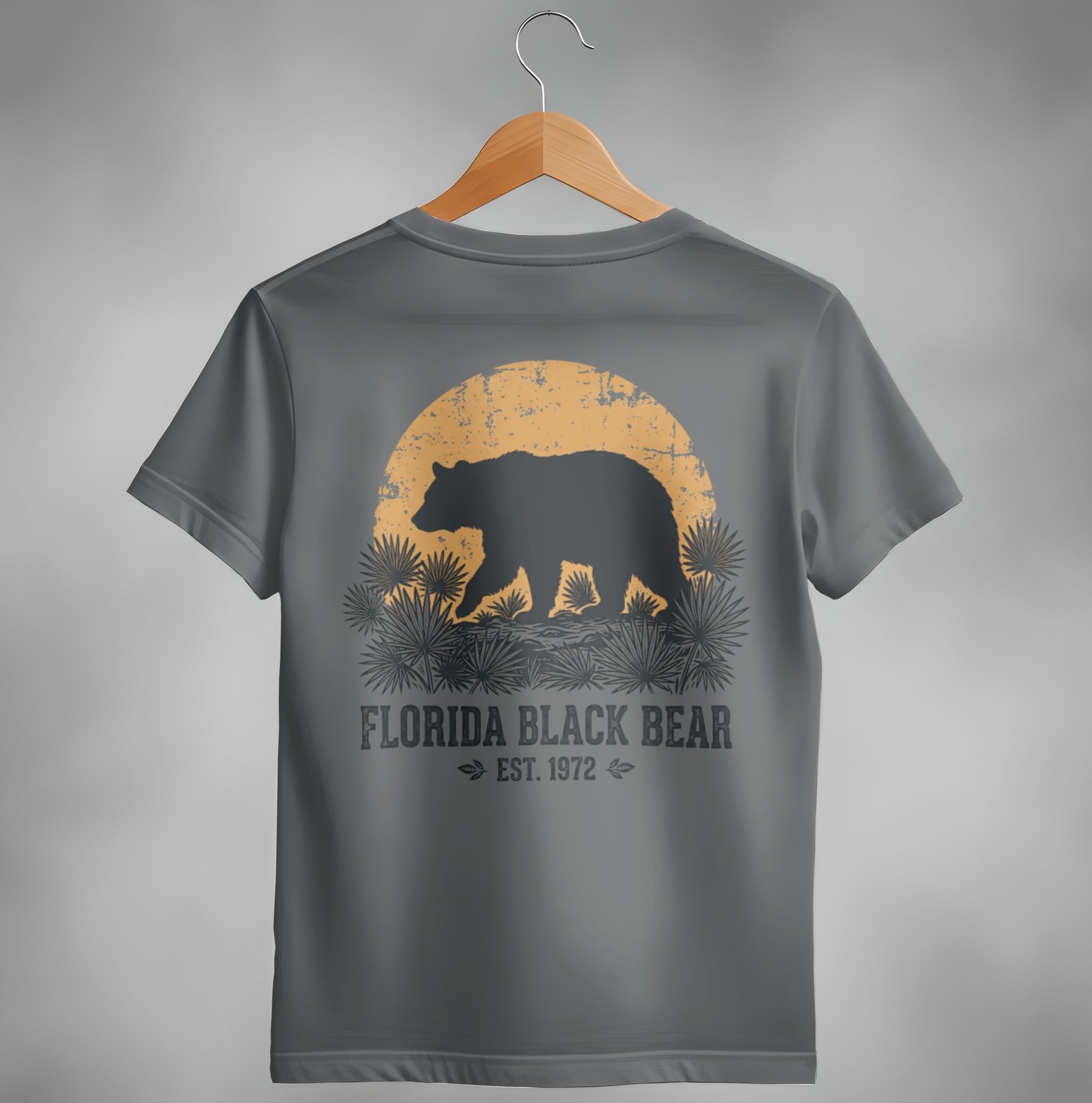 Grey t-shirt back with black bear silhouette against a sun and palm fronds.