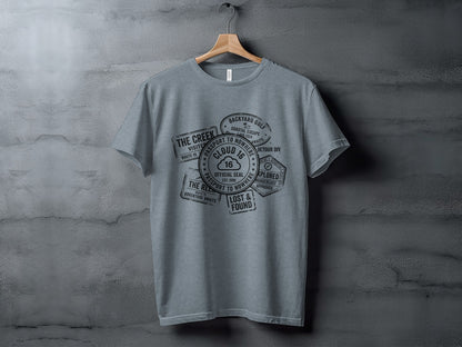 Rugged Wanderlust Passport Stamp Graphic Wilderness Shirt: Gray t-shirt with passport stamp graphic featuring "Cloud 16" and travel phrases.