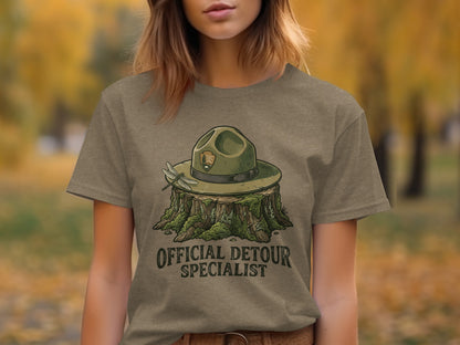 Official Detour Specialist Heritage | Vintage Outdoor Apparel: T-shirt graphic of a park ranger hat and dragonfly on a tree stump.