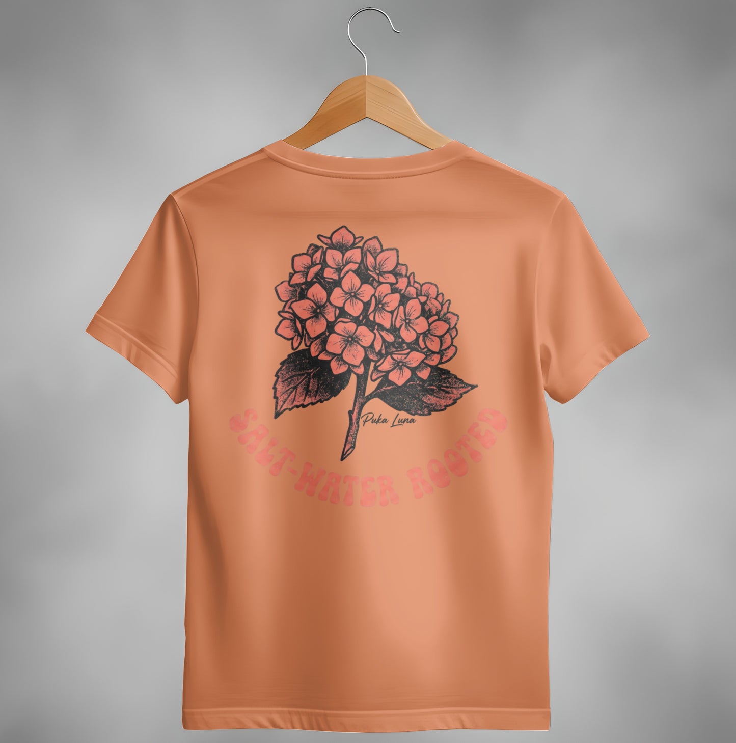 Peach t-shirt with floral hydrangea design and text "SONG WATER HOODS".