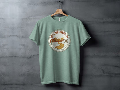 Detour Division Heritage | Vintage Outdoor Apparel: Green t-shirt with circular "Detour Division" logo featuring mountains and compass.