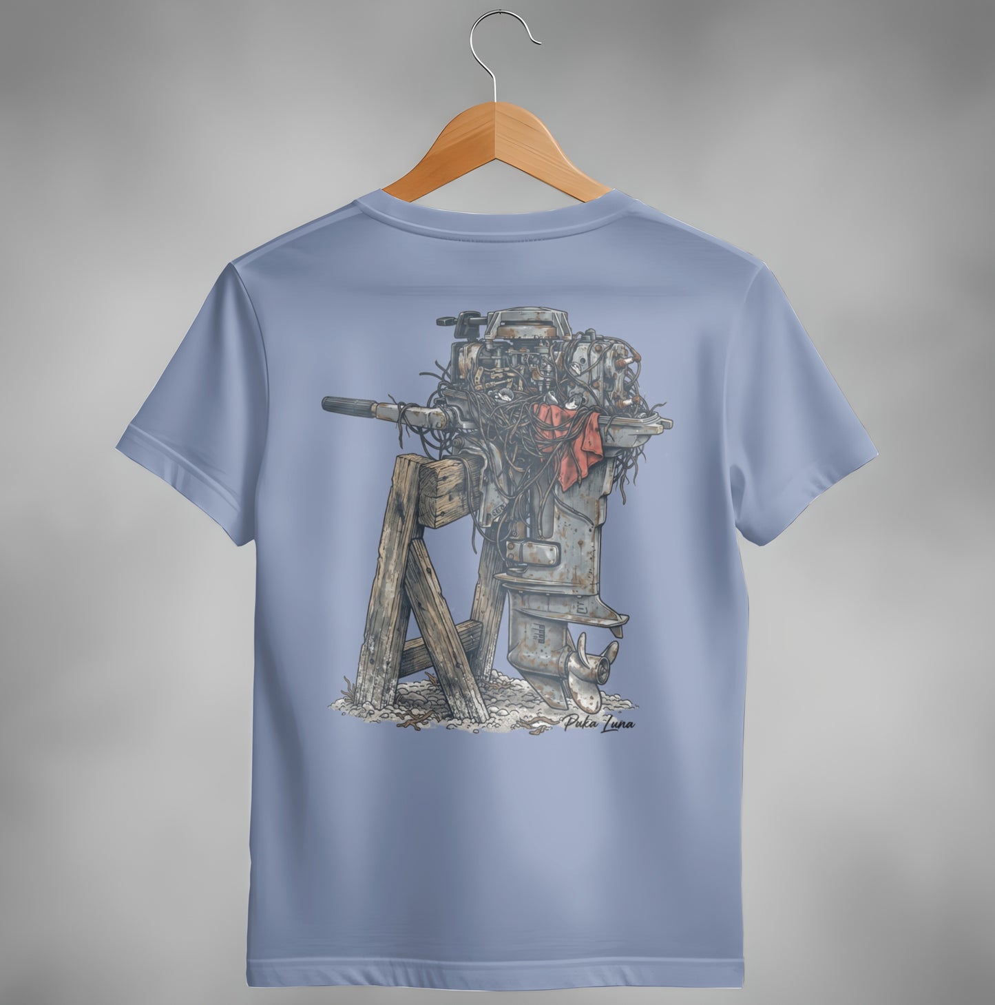 Outboard motor illustration on a light blue t-shirt.