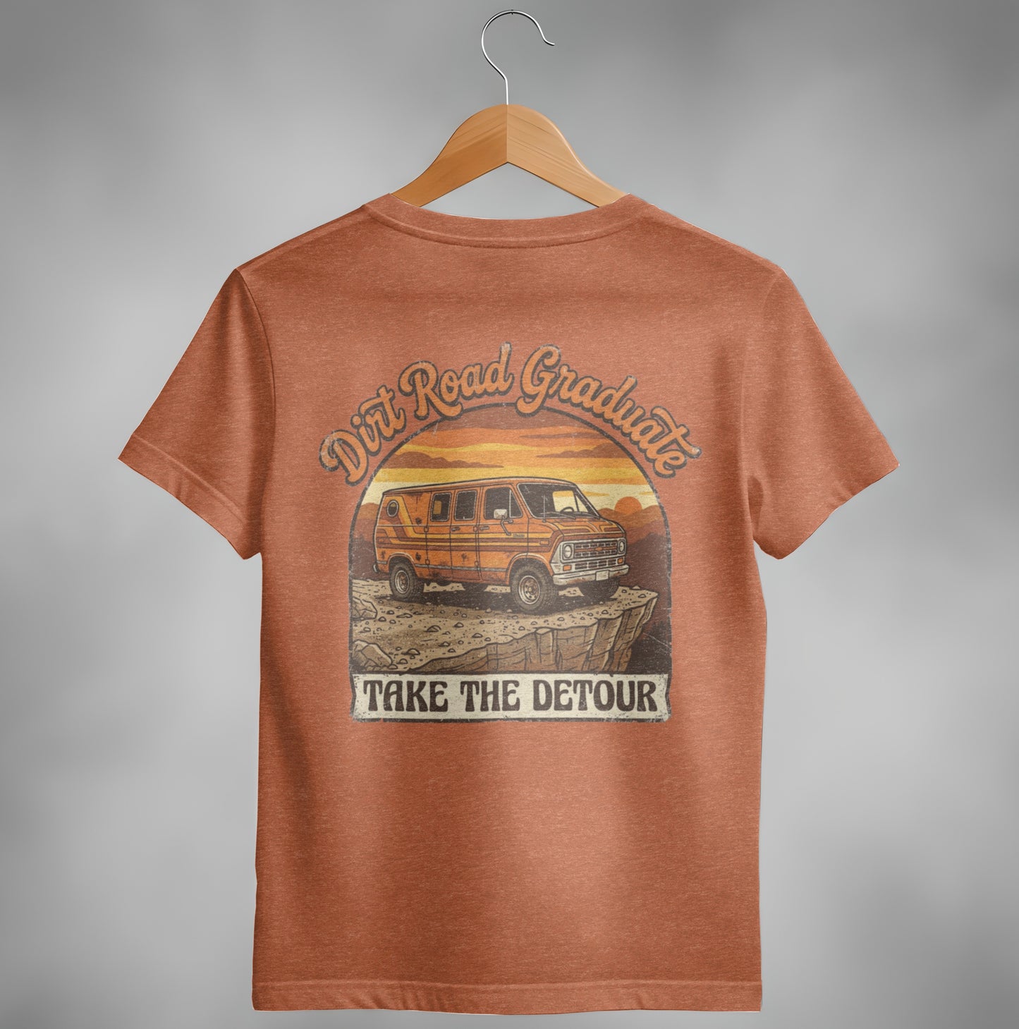 Orange t-shirt with a graphic of a vintage van and "Dirt Road Graduate Take The Detour".