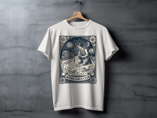 White t-shirt with "Weird Girls Club" emblem featuring a woman and celestial motifs.
