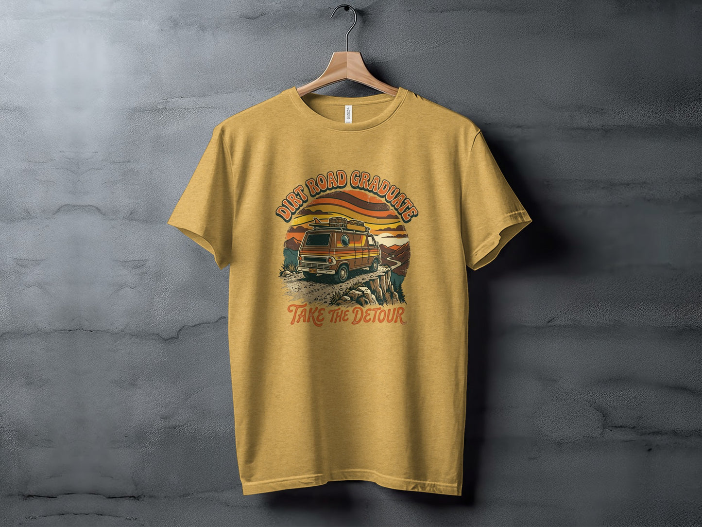 Heritage Dirt Road Graduate Adventure Tee Nomad Tee: Yellow t-shirt with vintage van, mountains, and "Dirt Road Graduates Take the Detour" text.