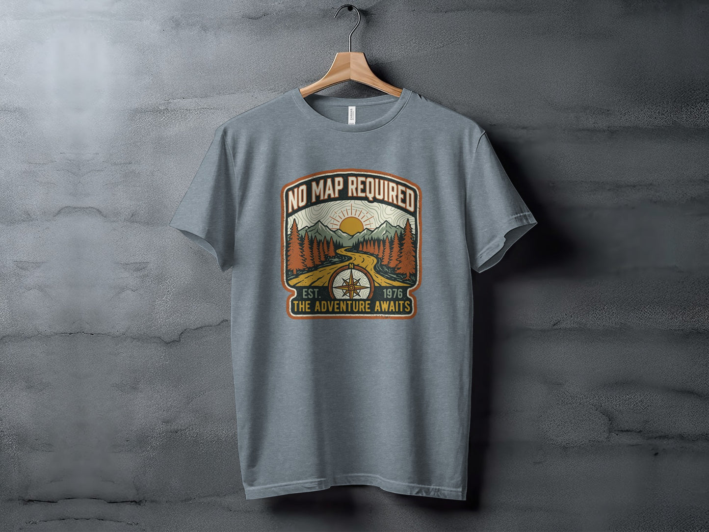 Heritage No Map Required: The Adventure Awaits Nomad Tee: Grey t-shirt with "No Map Required, Est. 1976 The Adventure Awaits" mountain design.