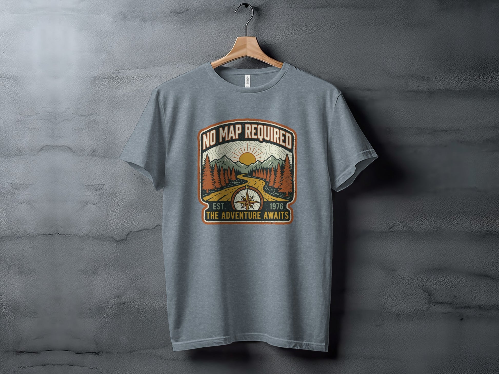 Heritage No Map Required: The Adventure Awaits Nomad Tee: Grey t-shirt with "No Map Required, Est. 1976 The Adventure Awaits" mountain design.