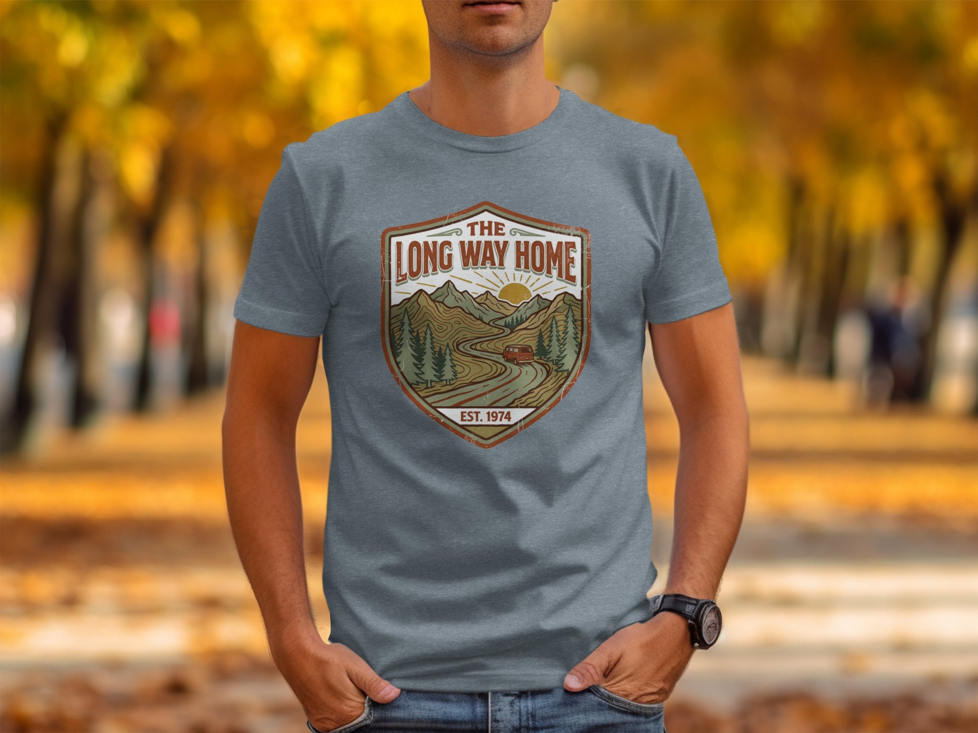 Rugged The Long Way Home | Vintage Adventure Wilderness Shirt: Gray t-shirt with "The Long Way Home" logo featuring a winding road and mountains.