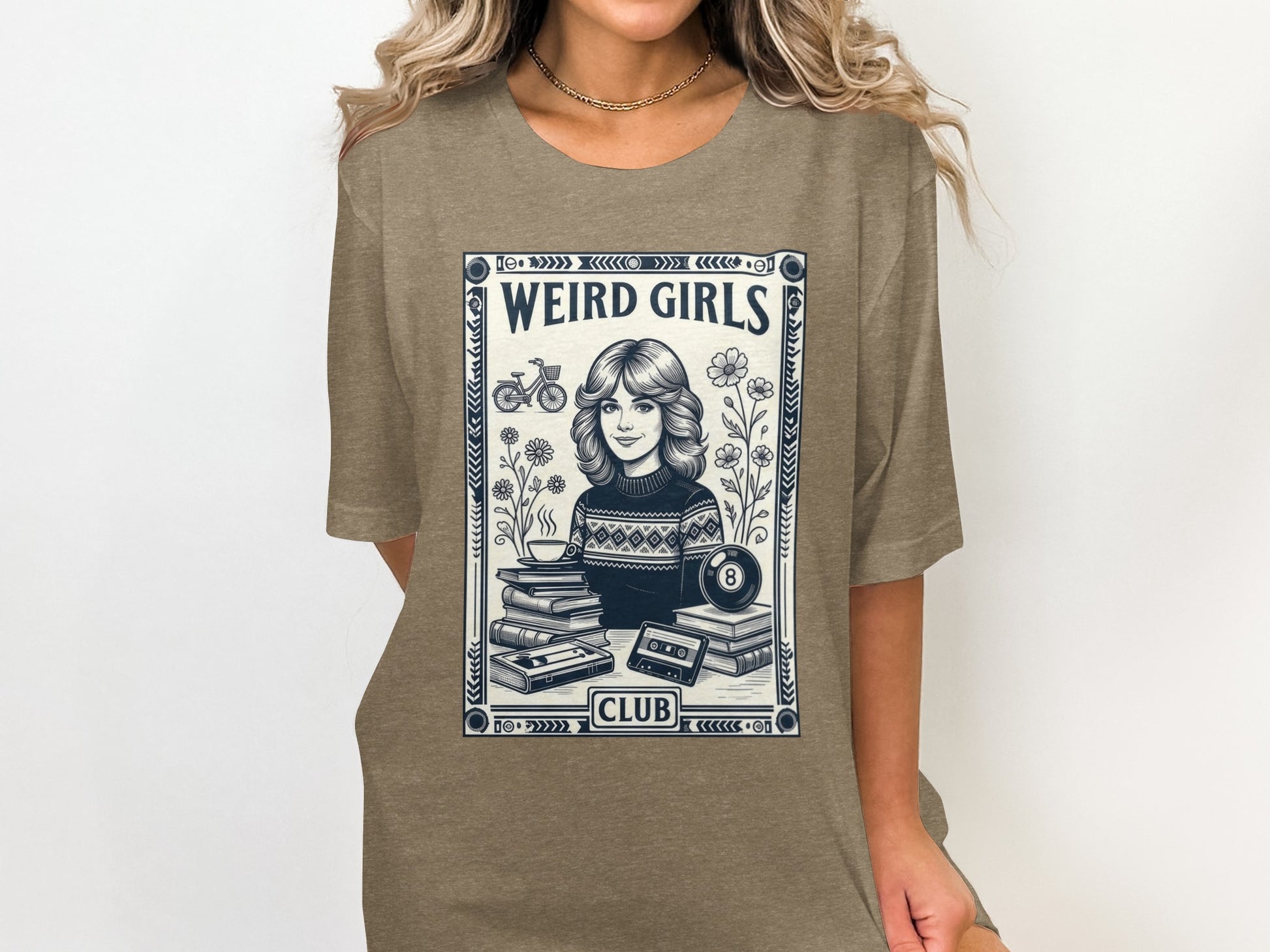 T-shirt with "Weird Girls Club" text and vintage-style illustration.