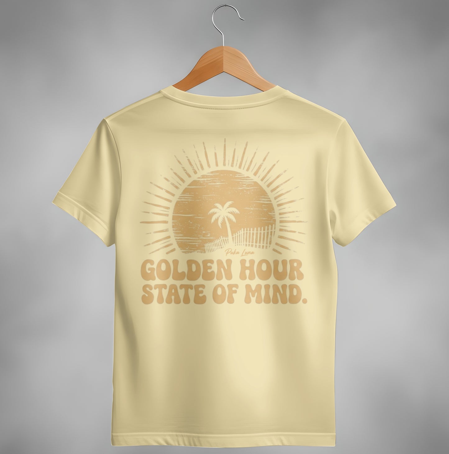 Cream t-shirt with "Golden Hour State of Mind" and a sun and palm tree graphic.