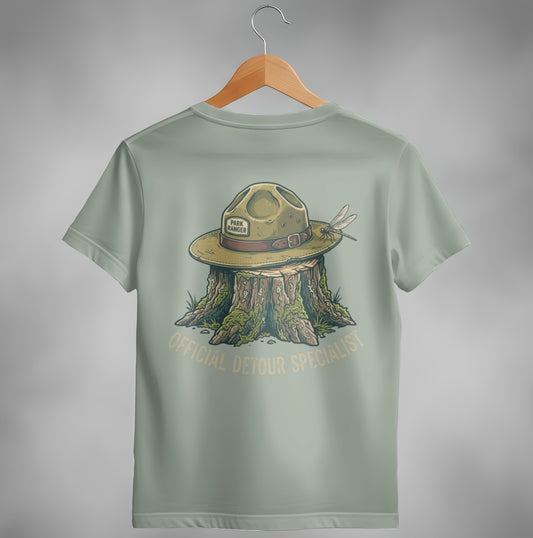 Park Ranger hat on a stump with dragonfly, "Official Detour Specialist" text.