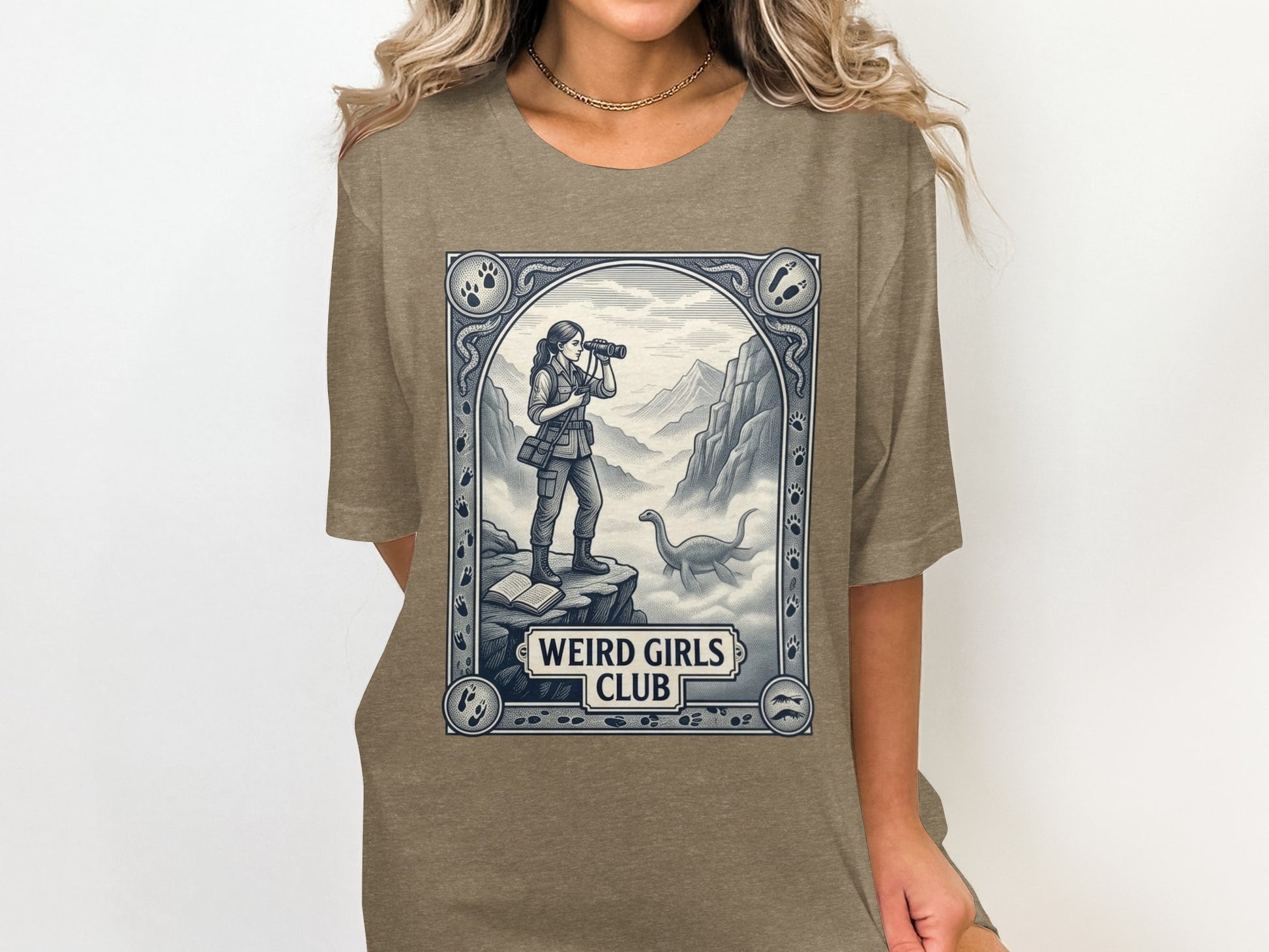 Woman wearing t-shirt with vintage illustration of explorer and dinosaur.