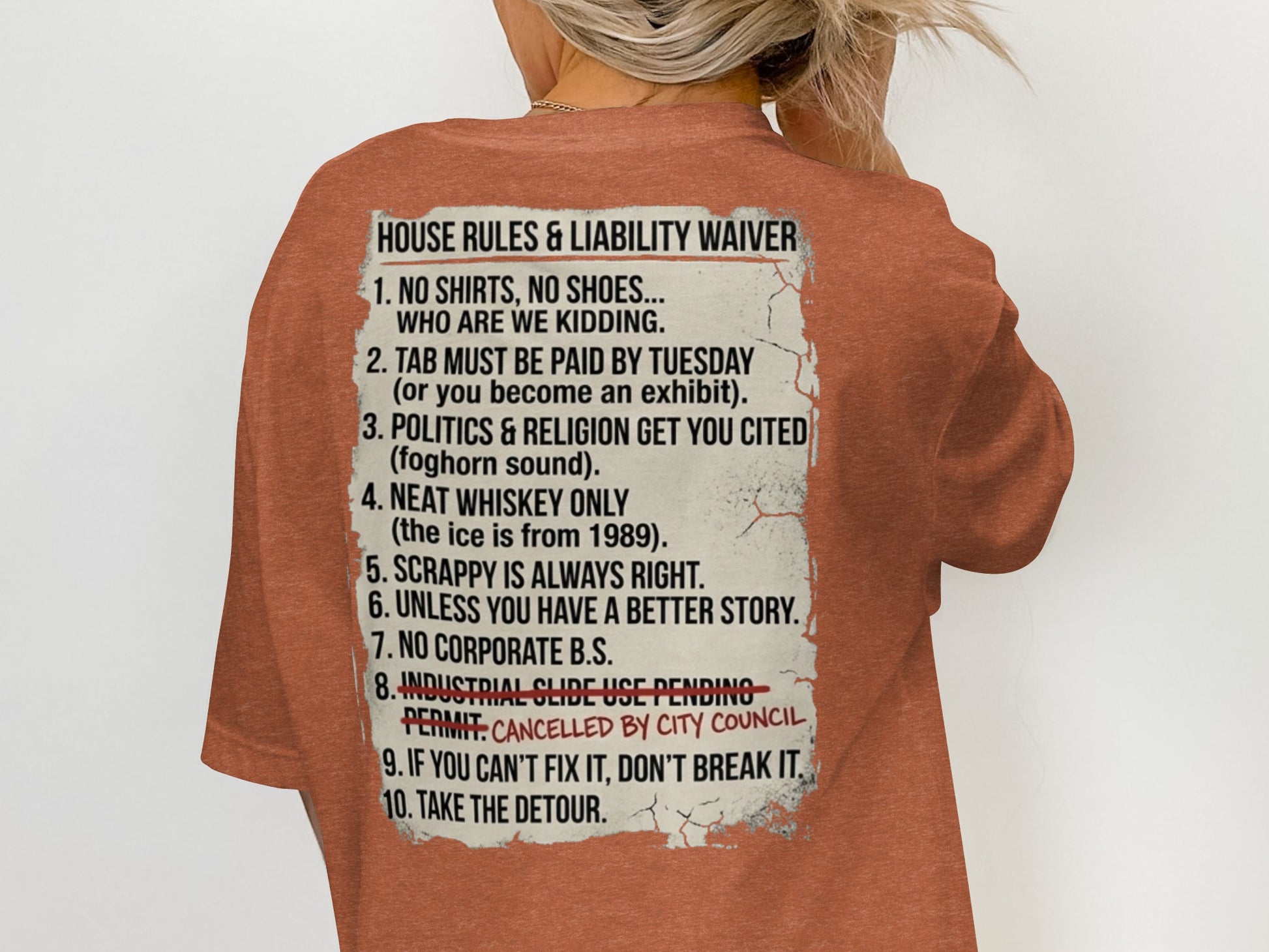 T-shirt with "House Rules & Liability Waiver" text.