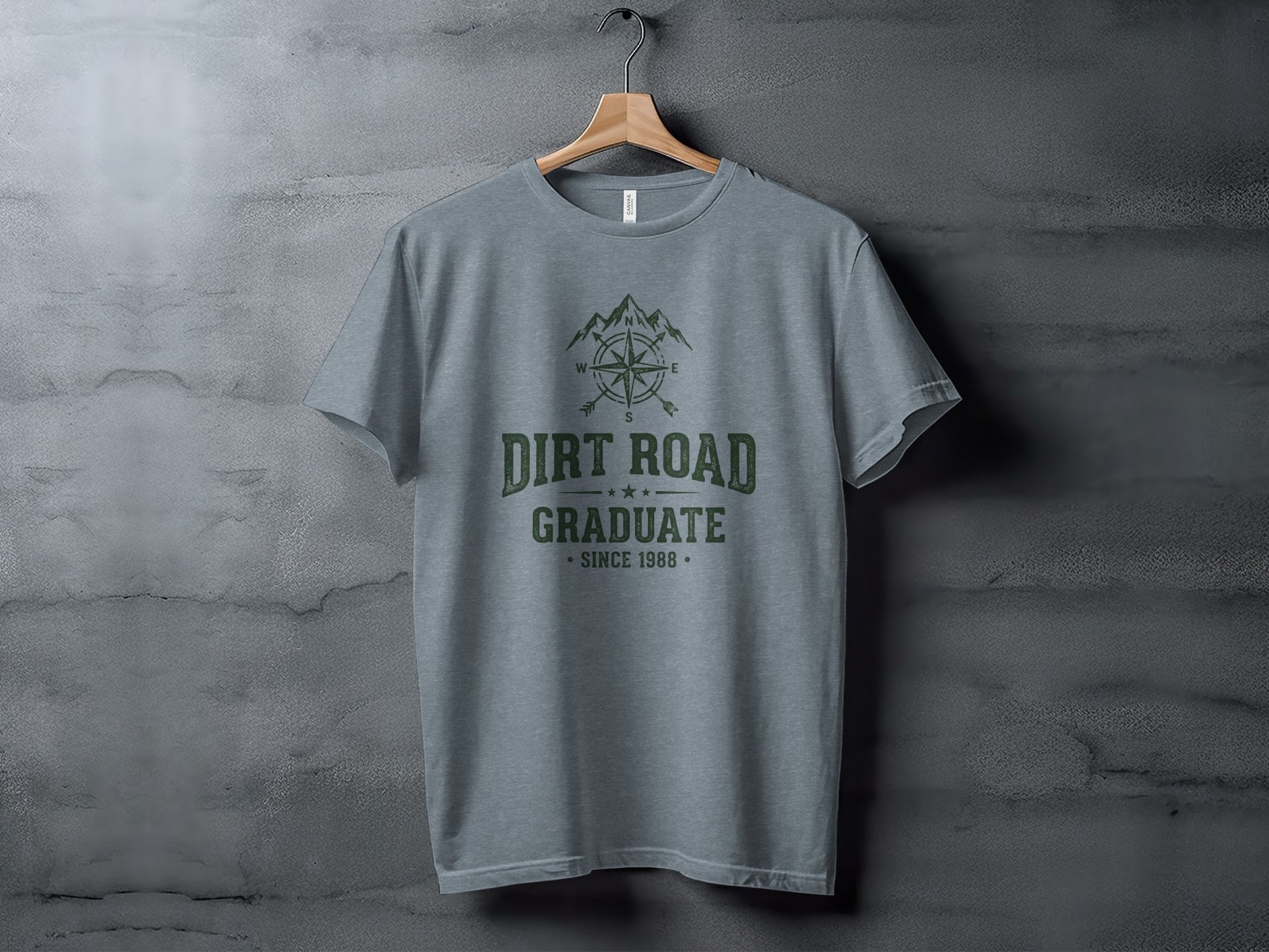 The Original Dirt Road Graduate Outdoor Adventure Top: Gray t-shirt with "Dirt Road Graduate Since 1988" text and compass design.