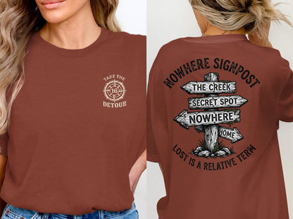 Brown t-shirt with "Take the Detour" on front, and "Nowhere Signpost" design on back.