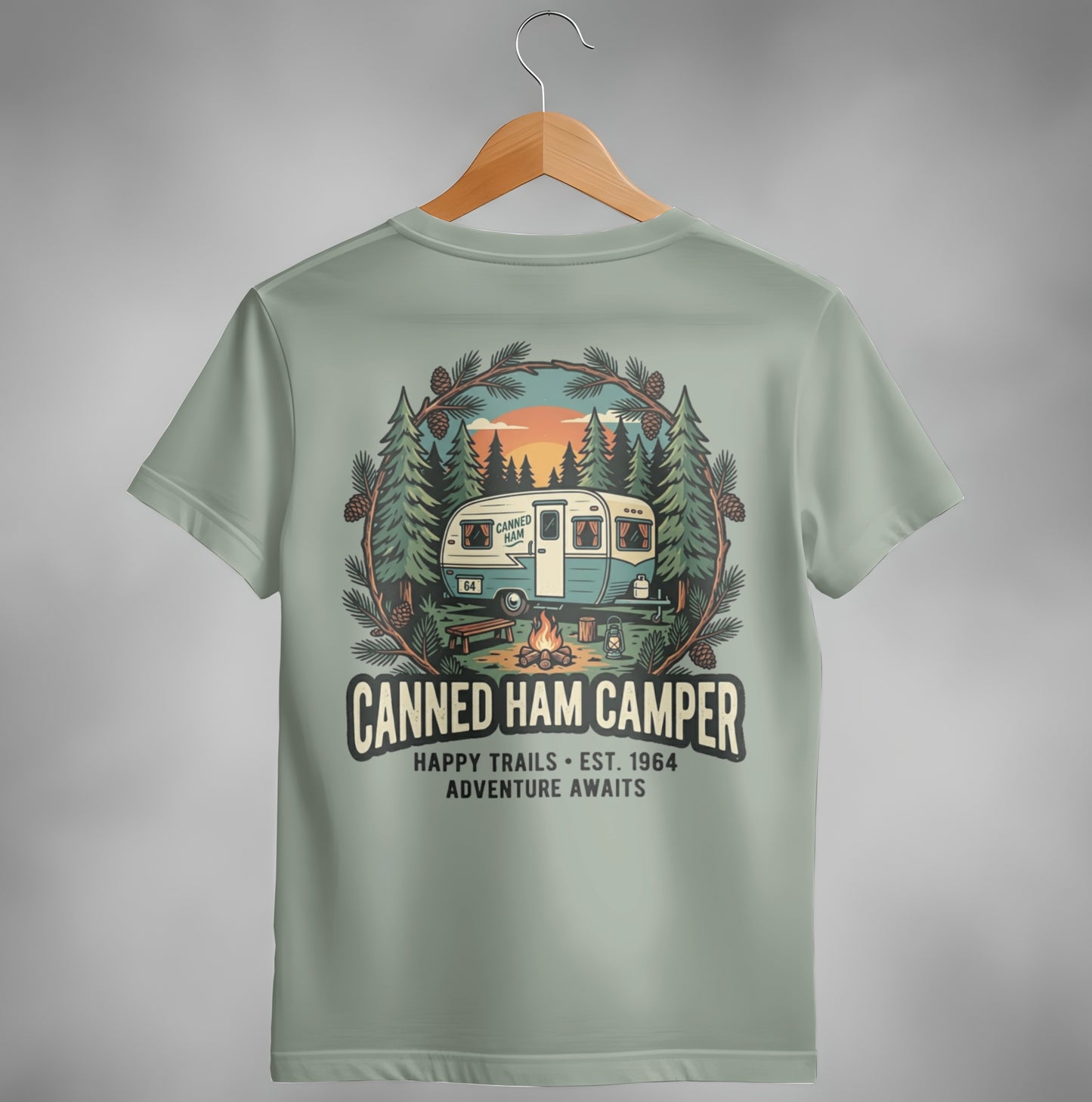 T-shirt with vintage camper, "Canned Ham Camper" text, and pine trees.