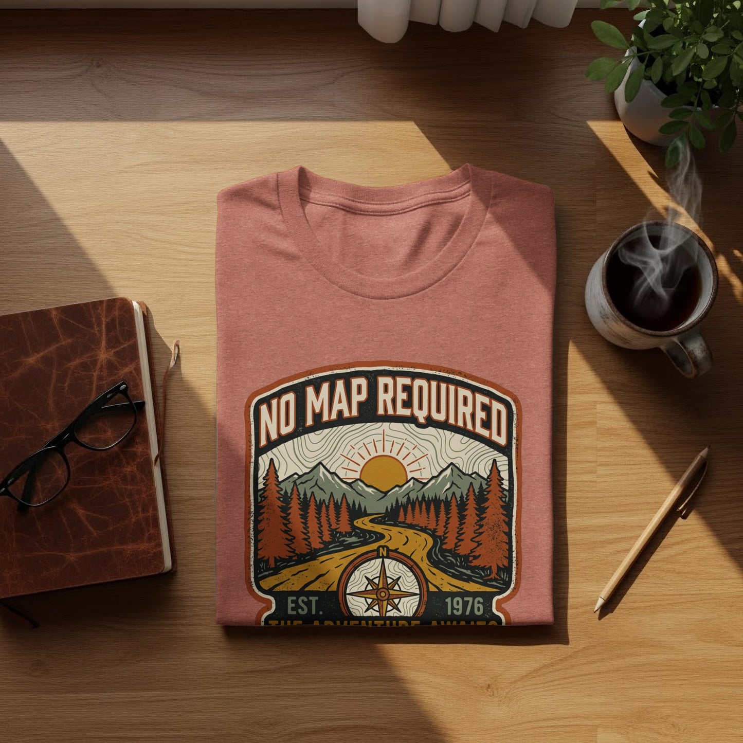 Heritage No Map Required: The Adventure Awaits Nomad Tee: T-shirt with "No Map Required" and compass graphic, featuring mountains and trees.