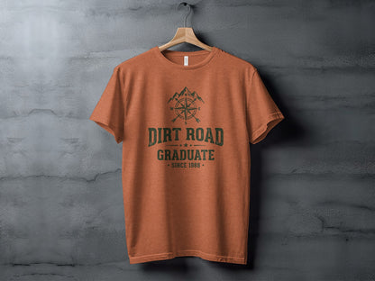 The Original Dirt Road Graduate Outdoor Adventure Top: Orange t-shirt with "Dirt Road Graduate" and compass design.