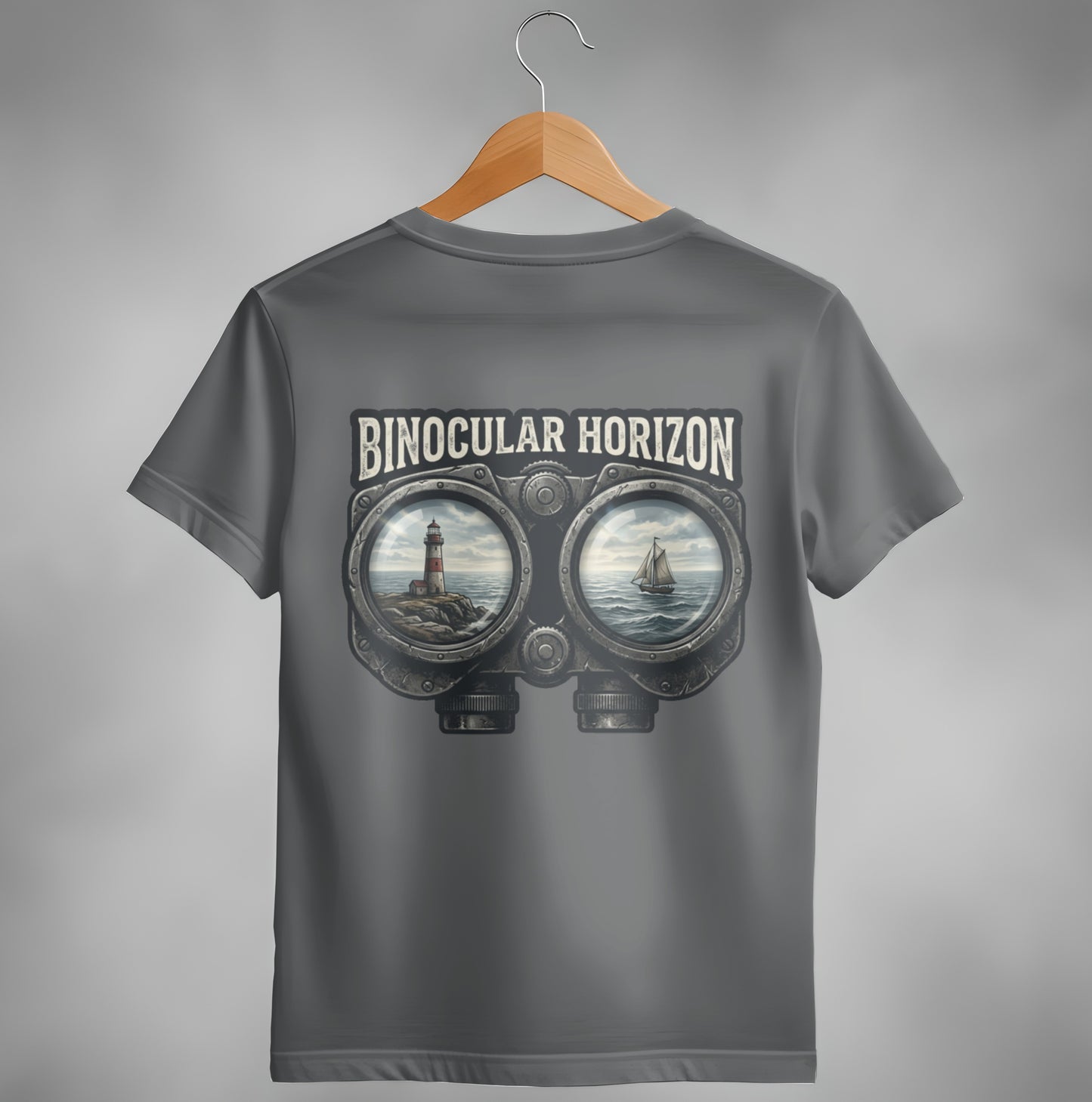 T-shirt with binoculars graphic showing lighthouse and sailboat on ocean.