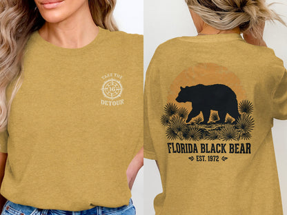 Yellow t-shirt with "Take the Detour 16" on front, and black bear silhouette on back.