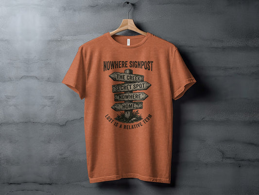 Nowhere Signpost Adventure: Backcountry Outpost Shirt: Orange t-shirt with a "Nowhere Signpost" graphic with destinations.