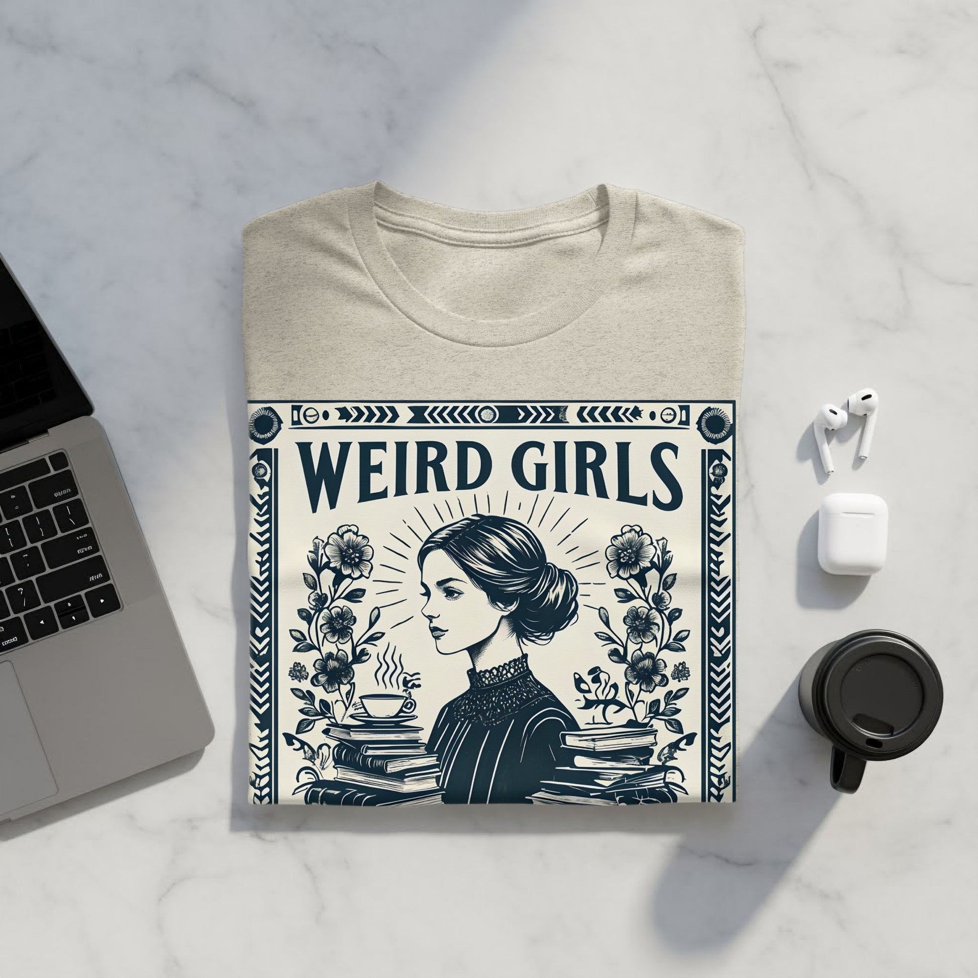 T-shirt with "Weird Girls" text and woman drinking coffee amongst books.