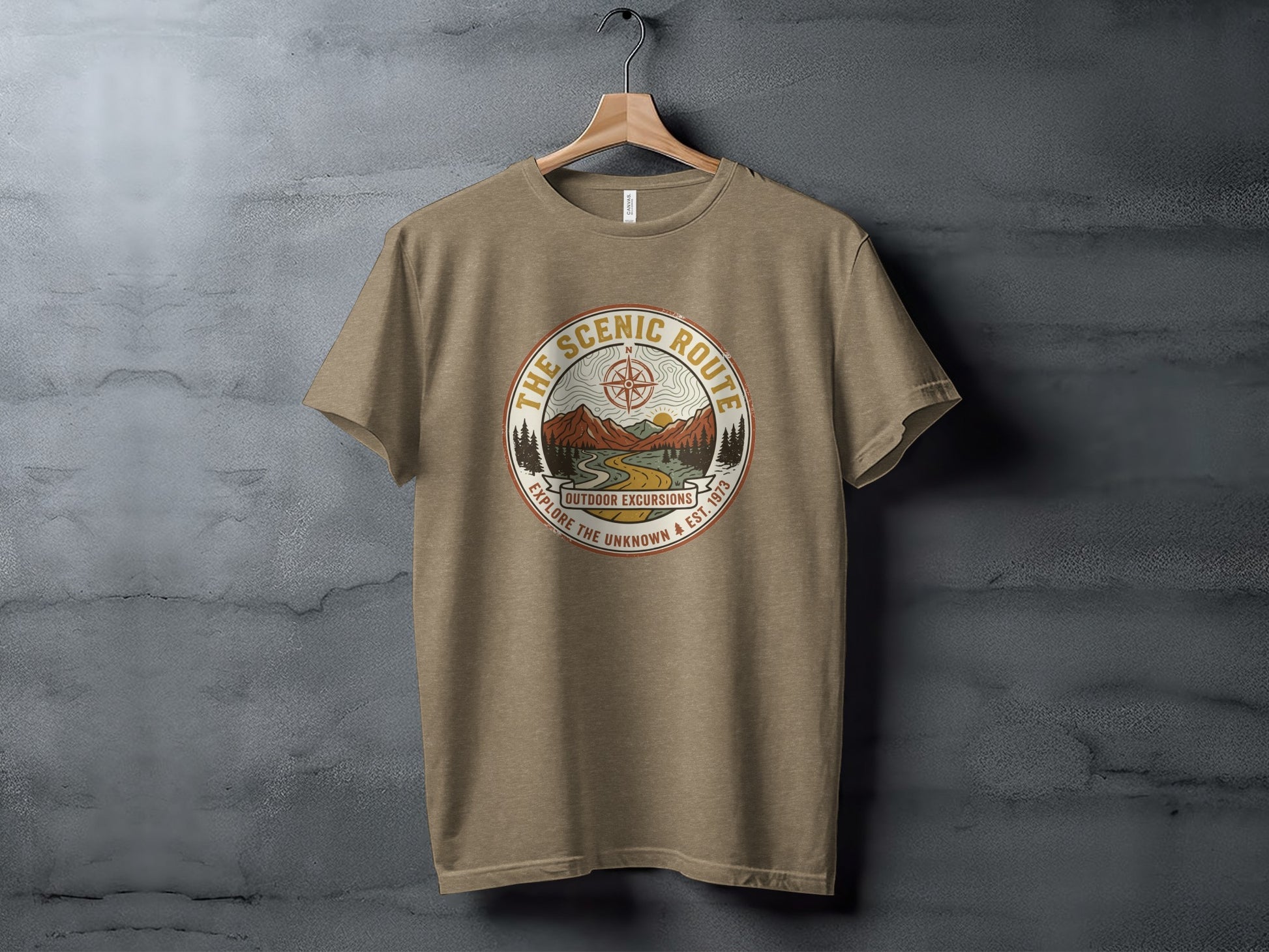 Heritage Scenic Route Vintage Explorer Tee Nomad Tee: Brown t-shirt with "The Scenic Route" circular graphic and mountain illustration.