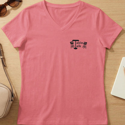 Pink v-neck t-shirt with "Table Talk" logo featuring a table and chairs.