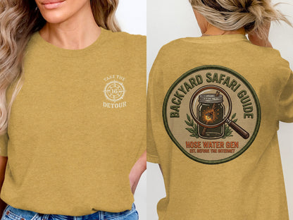 Yellow t-shirt with "Take the Detour" graphic on front, "Backyard Safari Guide" patch on back.