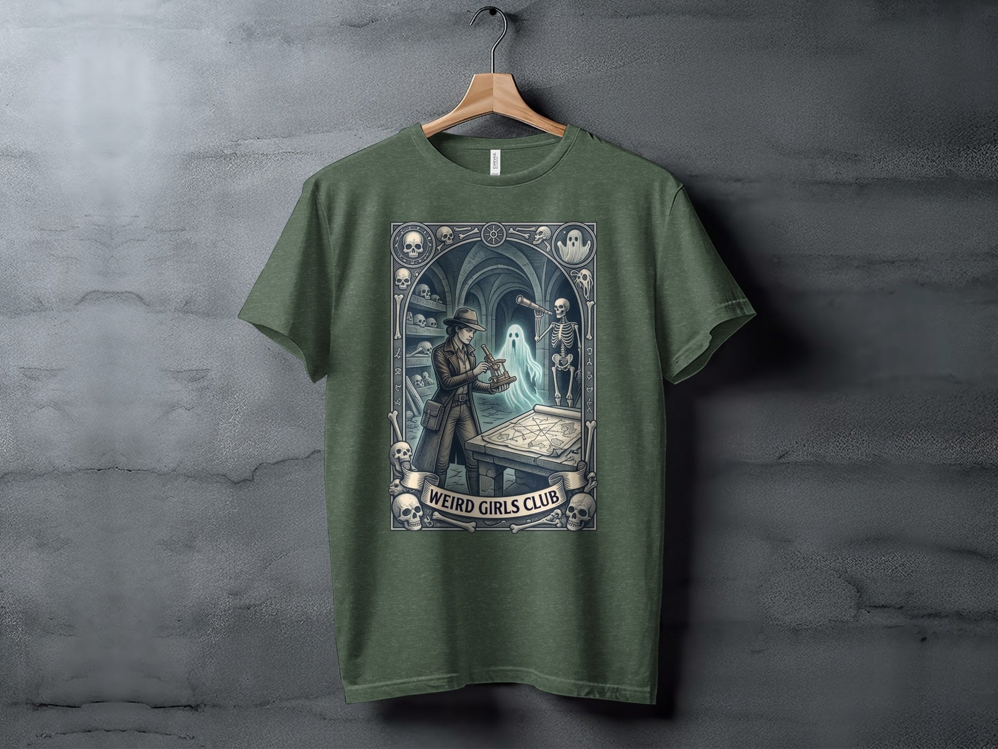 Green t-shirt with "Weird Girls Club" and occult-themed artwork.