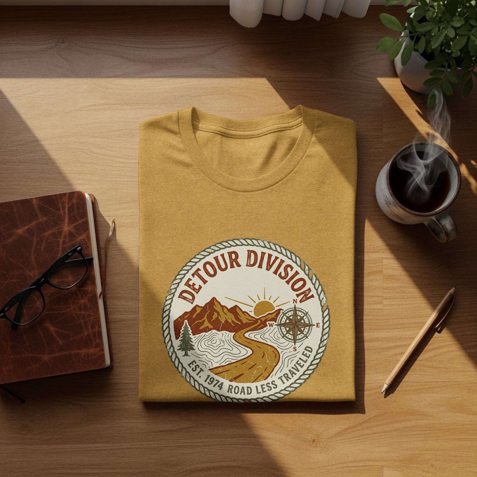 Detour Division Heritage | Vintage Outdoor Apparel: Mustard t-shirt with "Detour Division Est. 1974 Road Less Traveled" circular logo.