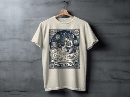 T-shirt with celestial map and "Weird Girls Club" text.