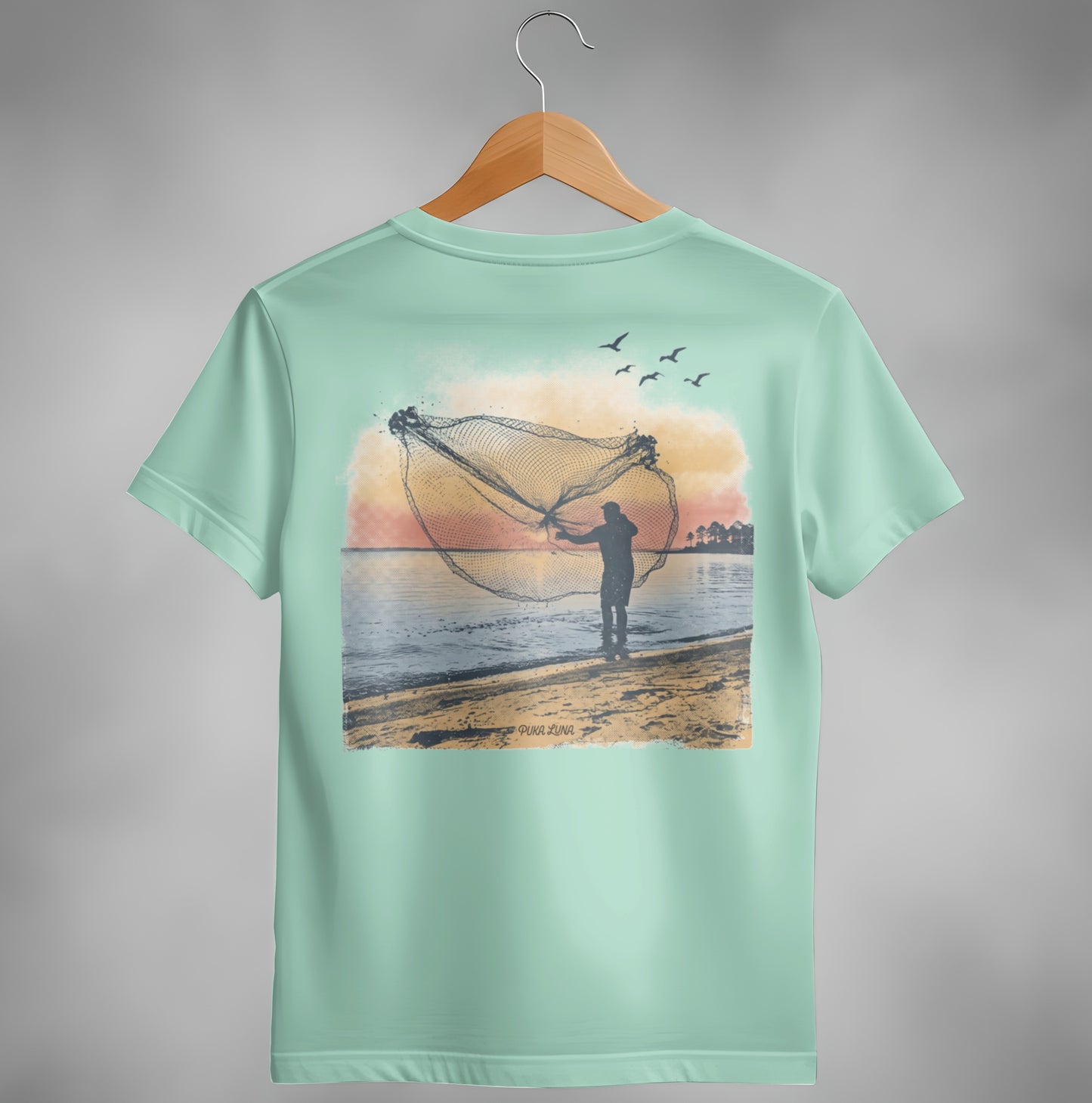 Fisherman casting net at sunset over water with birds flying overhead.